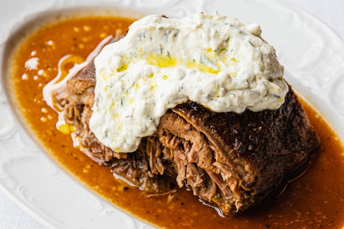 a plate of slow cooked lamb shoulder from greca
